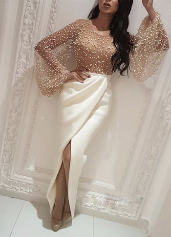 Νέο μοντέλο γυναικείο μακρύ φόρεμα με μακρύ μανίκι και σχισμή σε λευκό χρώμα