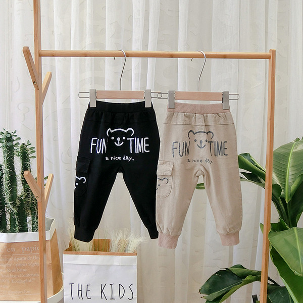 Pantaloni sport pentru copii model nou cu buzunar in negru si maro pentru baieti