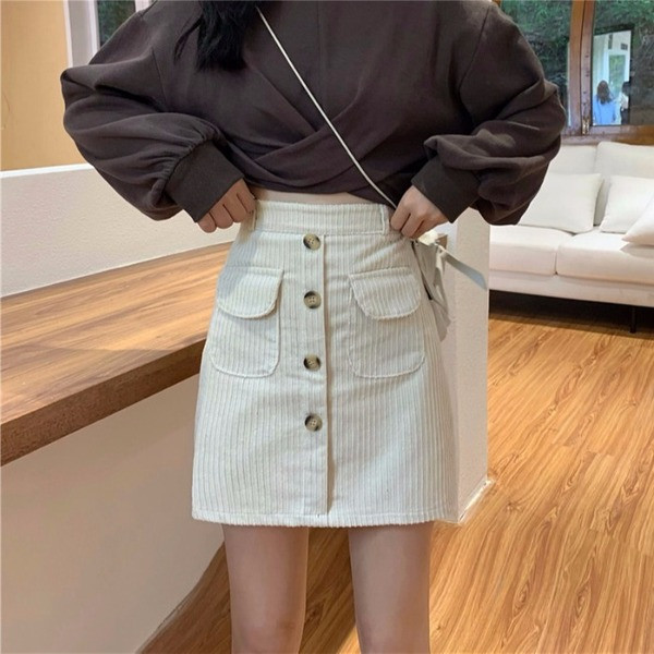 Rövid kordbársony szoknya magas derékkal, fehér, fekete és kék gombokkal