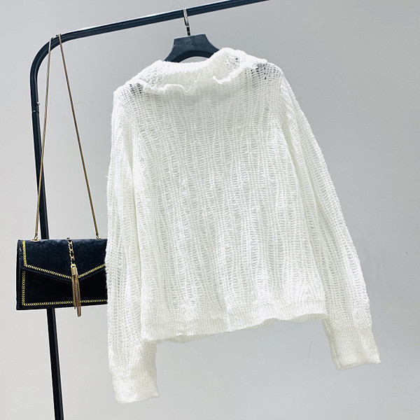 Aktuális női mellény zöld, barna és fehér gombokkal