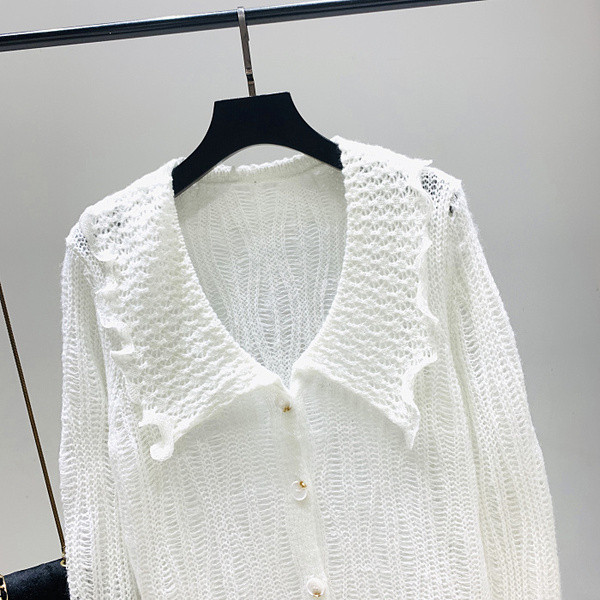 Aktuális női mellény zöld, barna és fehér gombokkal