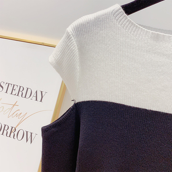 Modern női pulóver kivágott részekkel