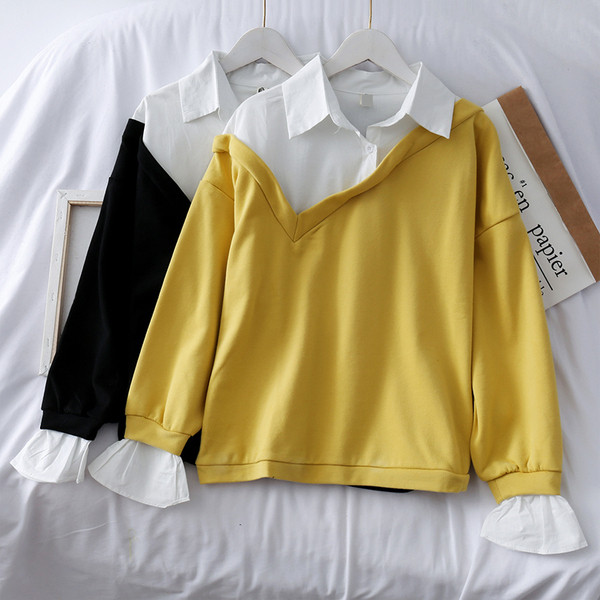 Μοντέρνα γυναικεία μπλούζα σε μαύρο και κίτρινο χρώμα με μακριά μανίκια και γιακά