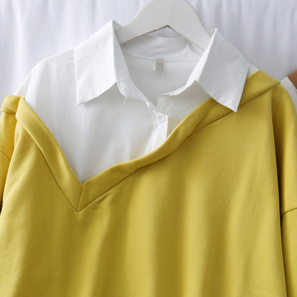 Μοντέρνα γυναικεία μπλούζα σε μαύρο και κίτρινο χρώμα με μακριά μανίκια και γιακά