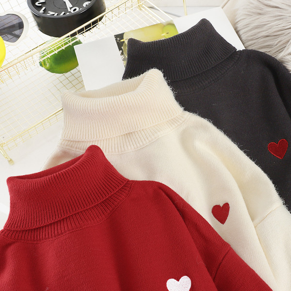 Női pulóver magas gallérral több színben