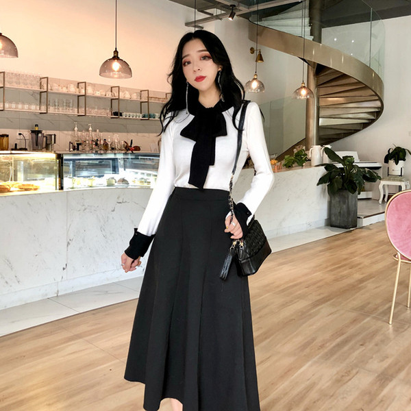 Bluza de dama eleganta cu panglica pe decolteu in alb si negru