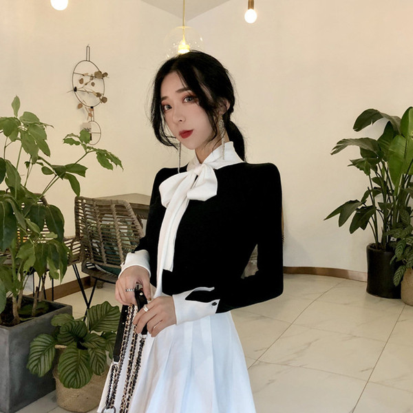 Bluza de dama eleganta cu panglica pe decolteu in alb si negru