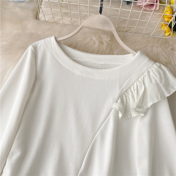 Bluză de damă modernă model asimetric cu decolteu oval și bucle