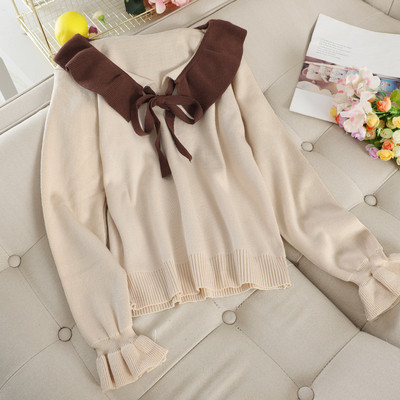 Női pulóver szalaggal és gallérral több színben