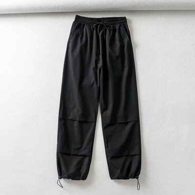 Pantaloni sport de dama cu cravate in alb, negru si mov