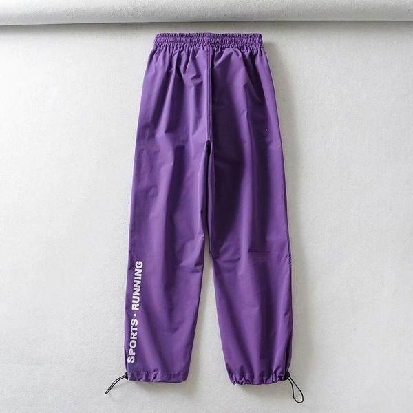 Pantaloni sport de dama cu cravate in alb, negru si mov