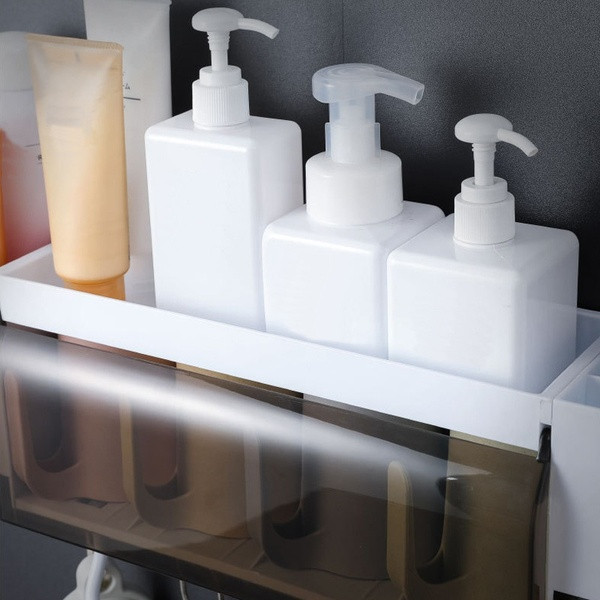Πρακτικός οργανωτής μπάνιου με κρεμάστρα και λευκό διανομέα οδοντόπαστας