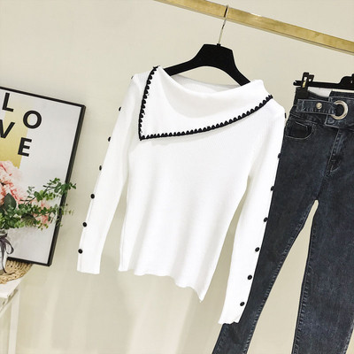 Modern női pulóver kerek nyakkivágással, fehér és bézs gombokkal