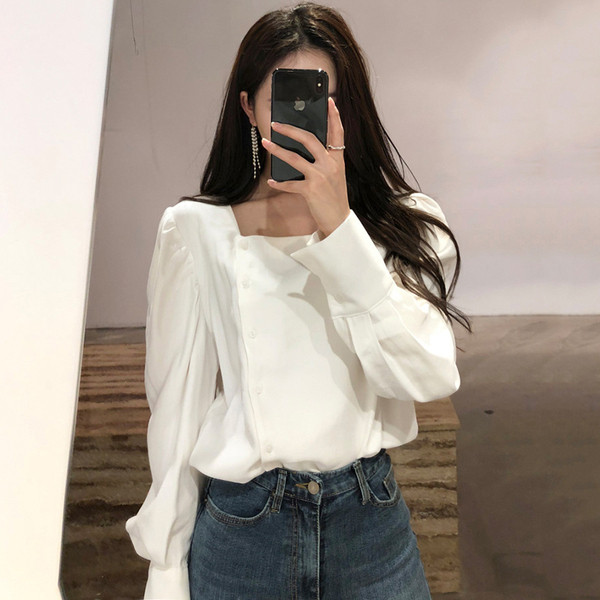 Bluza de dama cu nasturi in alb si negru