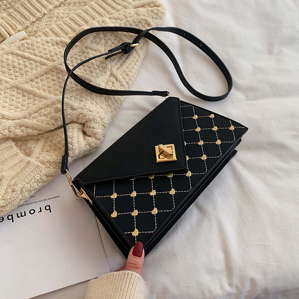 Geanta de dama moderna cu inchidere metalica in patru culori