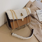 Geanta de dama moderna cu puf si element metalic in mai multe culori