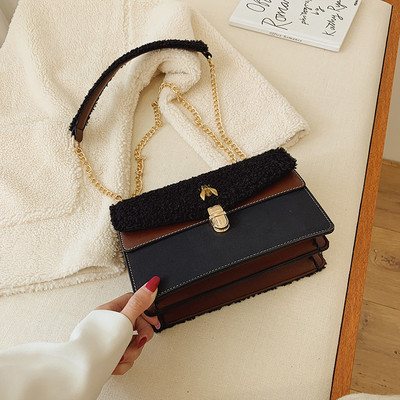 Geanta de dama moderna cu puf si element metalic in mai multe culori