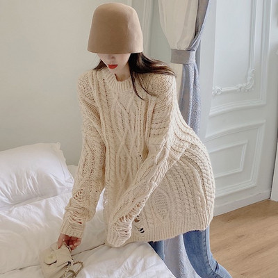 Pulover lung și lat cu motive rupte în roșu, verde și bej