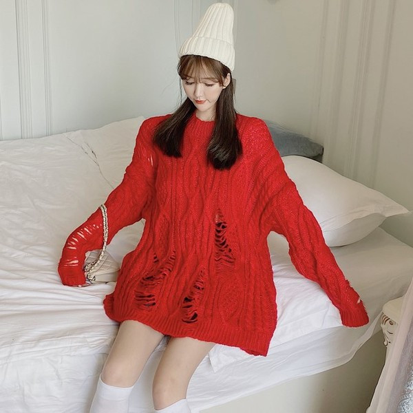 Pulover lung și lat cu motive rupte în roșu, verde și bej