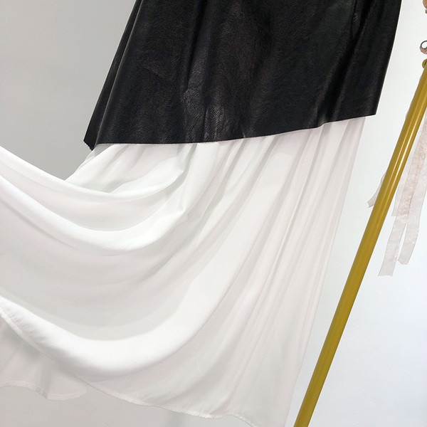 Fusta de dama cu croiala lunga cu bucati din piele ecologica