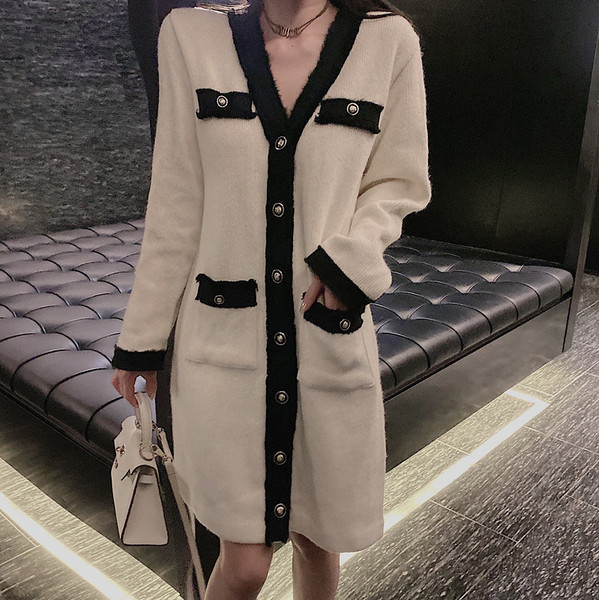 Vesta lunga eleganta in alb si negru cu nasturi