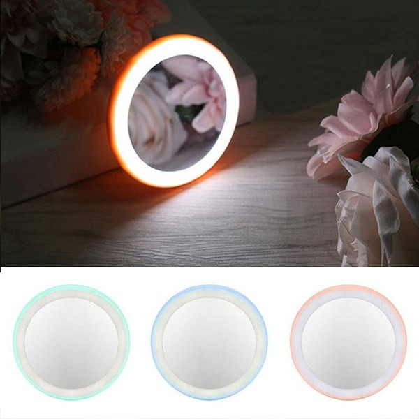Round mirror with LED lights in pink, green and blue