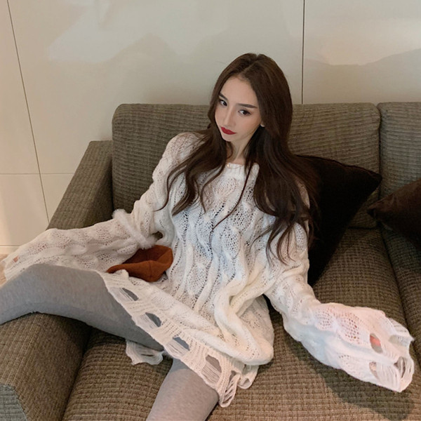 Μακρύ και φαρδύ γυναικείο πουλόβερ με σχισμένα μοτίβα