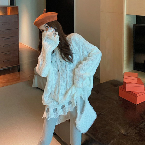 Μακρύ και φαρδύ γυναικείο πουλόβερ με σχισμένα μοτίβα