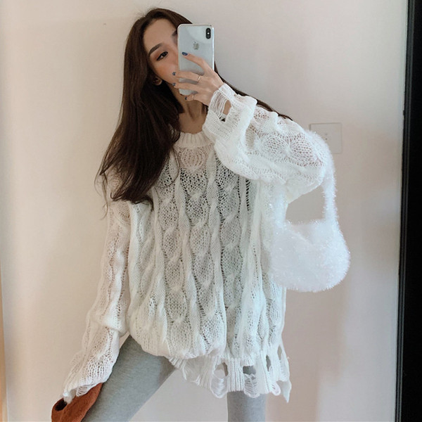 Μακρύ και φαρδύ γυναικείο πουλόβερ με σχισμένα μοτίβα