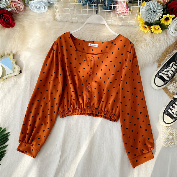 Μοντέρνα γυναικεία μπλούζα πουά σε άσπρο, ροζ, κίτρινο και πορτοκαλί χρώμα