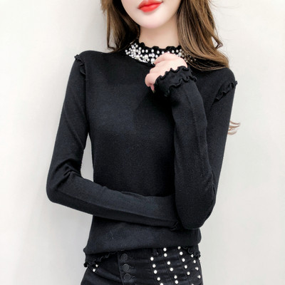 Γυναικεία μπλούζα της μόδας με διακοσμητικά μαργαριτάρια σε μαύρο και άσπρο χρώμα