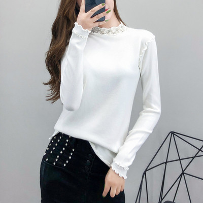 Γυναικεία μπλούζα της μόδας με διακοσμητικά μαργαριτάρια σε μαύρο και άσπρο χρώμα