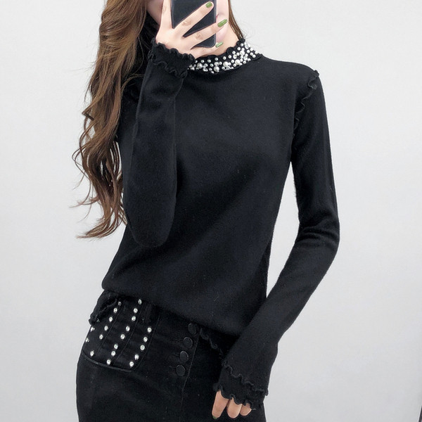Γυναικεία μπλούζα της μόδας με διακοσμητικά μαργαριτάρια σε μαύρο και άσπρο χρώμα