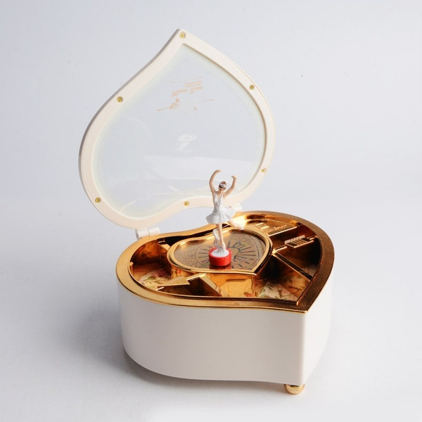 Music box with a rotating ballerina in the shape of a heart in pink and white