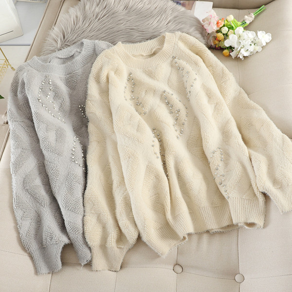 Női pulóver ovális nyakkivágással és gyöngyökkel több színben