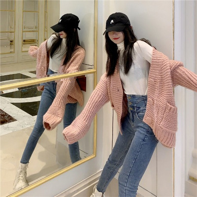 Vastag női mellény gombokkal és zsebekkel