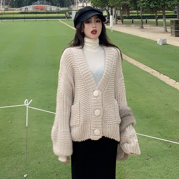 Vastag női mellény gombokkal és zsebekkel