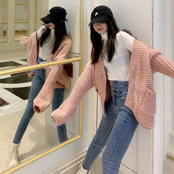 Vastag női mellény gombokkal és zsebekkel