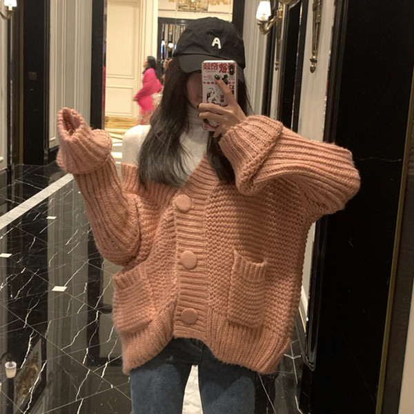 Vastag női mellény gombokkal és zsebekkel