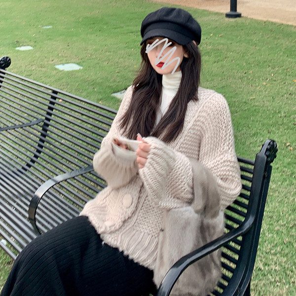 Vastag női mellény gombokkal és zsebekkel