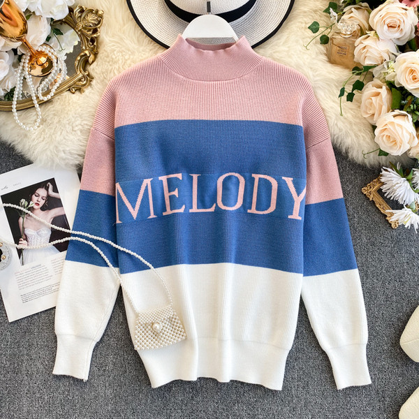 Alkalmi női pulóver pólógallérral és felirattal három színben