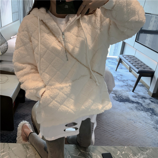 Női széles pulóver cipzárral és zsebekkel