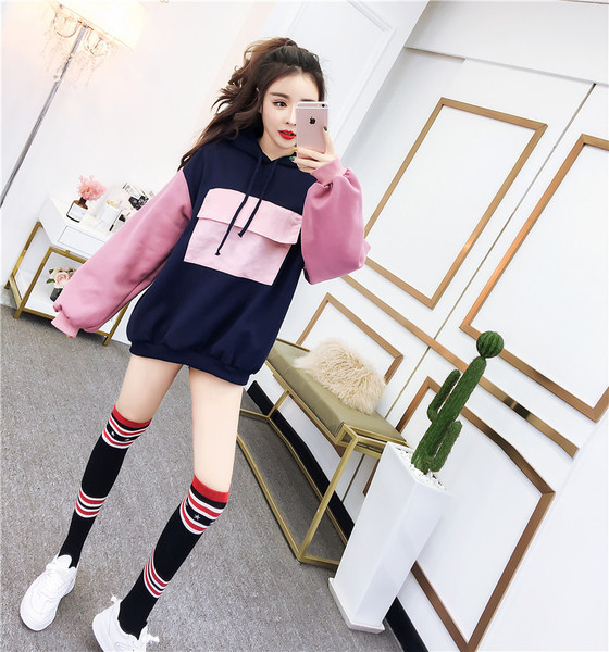 Női széles pulóver kapucnival és zsebbel több színben