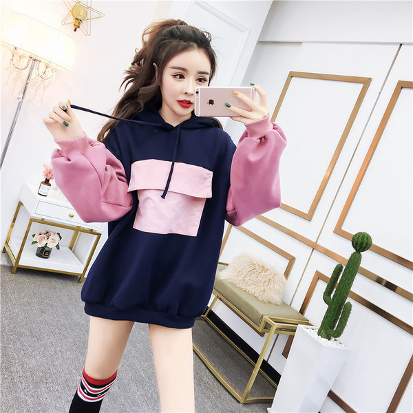 Női széles pulóver kapucnival és zsebbel több színben