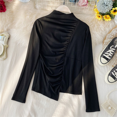 Alkalmi női blúz magas gallérral, aszimmetrikus modellel