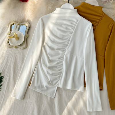 Alkalmi női blúz magas gallérral, aszimmetrikus modellel