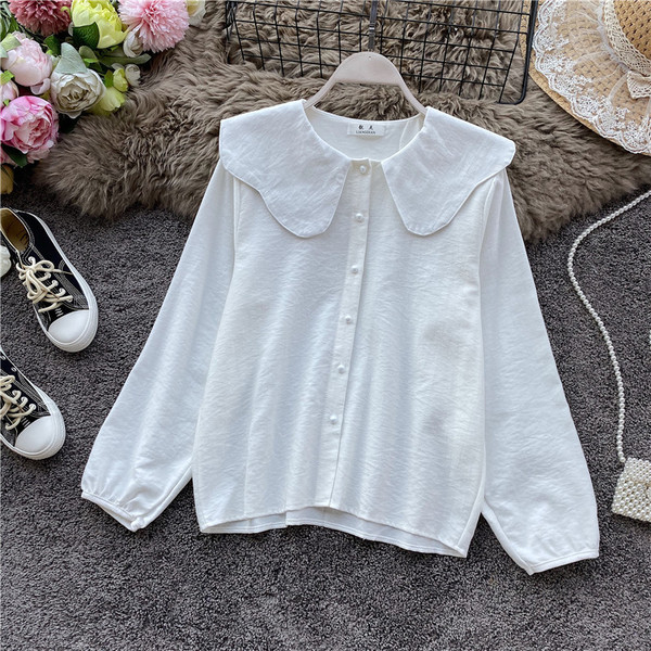 Modern női ing gombokkal és ovális nyakkivágással, négy színben