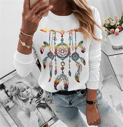 Női alkalmi blúz fehér színben, színes mintával