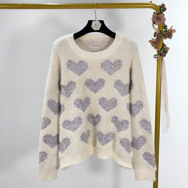 Női téli pulóver rátéttel és gyöngyökkel