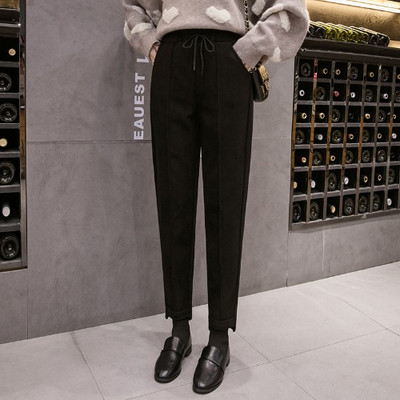 Divatos női nadrág zsebekkel fehér és fekete színben